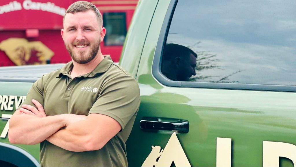 Alpha Wildlife Technician standing in front of his truck in Columbia sc