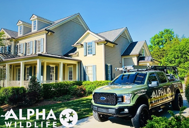 Alpha Wildlife Truck In Driveway